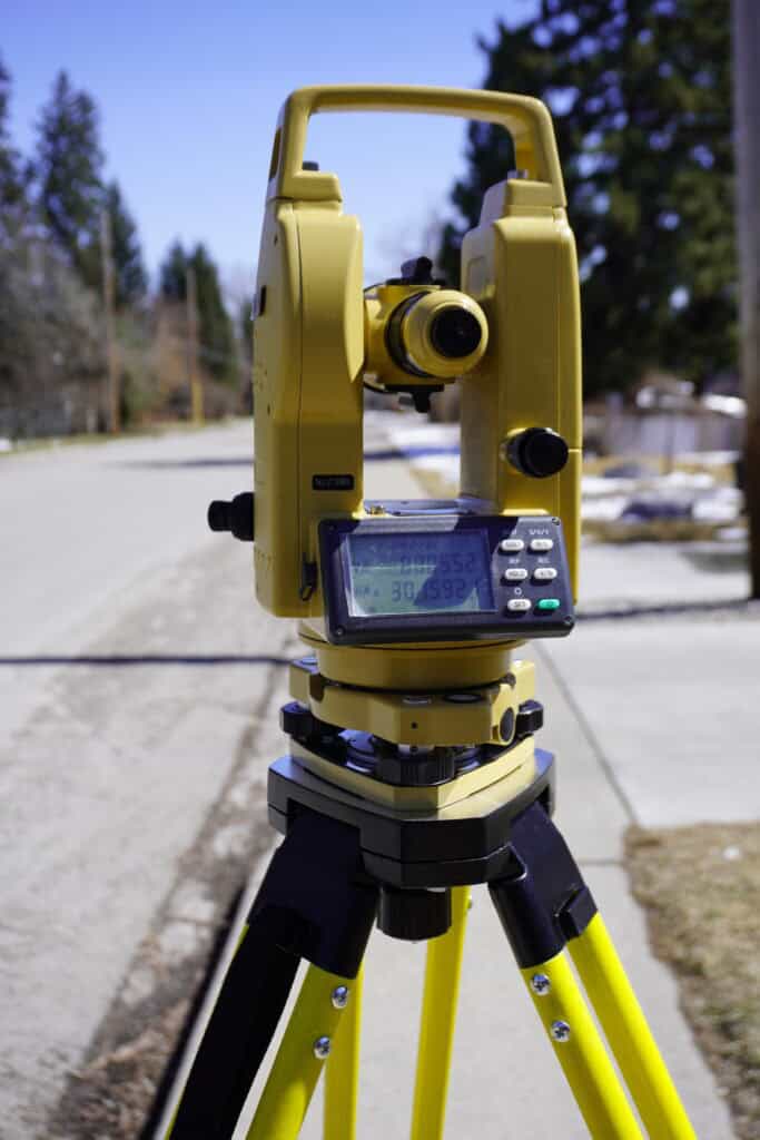 Digital theodolite on tripod for precise angle measurement in surveying